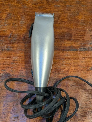 Silver and Black Adjustable Electric Hair Clippers with a Fixed Blade 