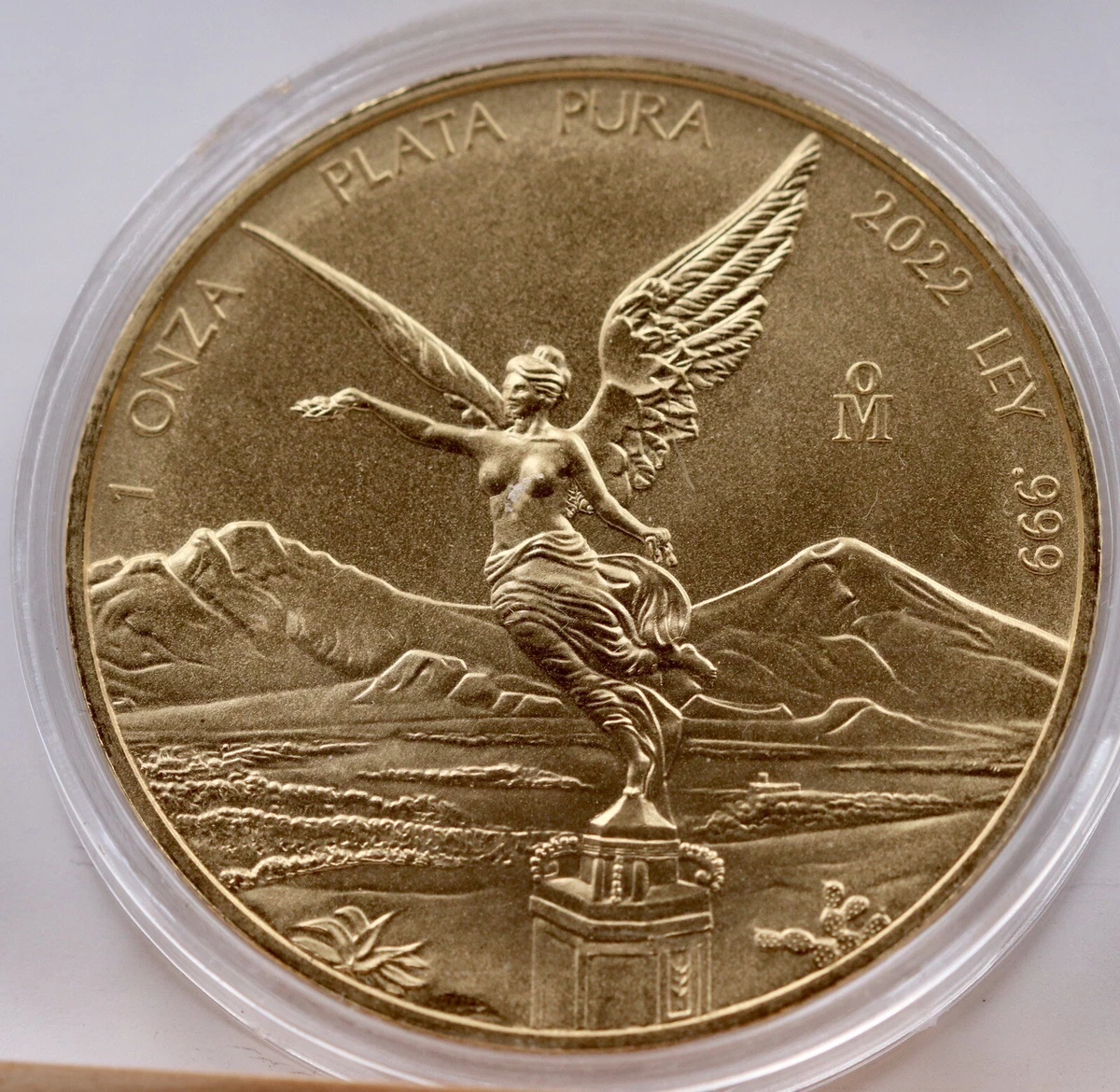 UNA ONZA DE MÉXICO DE PLATA BAŃADA EN ORO DE 24 QUILATES
