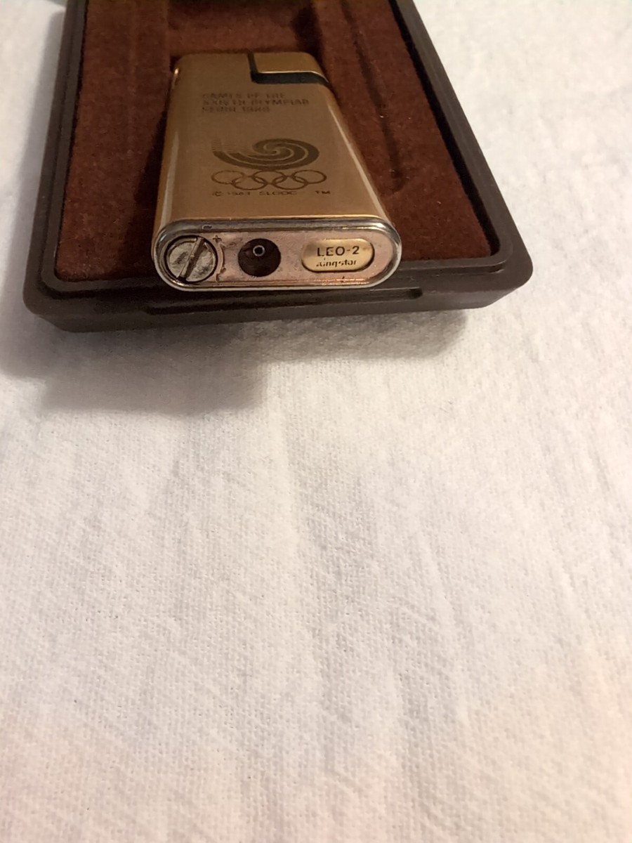 Vintage Gold Tone 1986 Olympics Kingstar Lighter . Comes