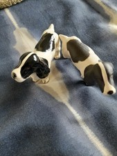 PAIR OF BLACK AND WHITE CHINA SPRINGER SPANIEL DOGS , ONE MATT , ONE SHINY