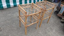 Pair of bamboo and Rattan bedside tables on legs with 2 clear glass shelves...