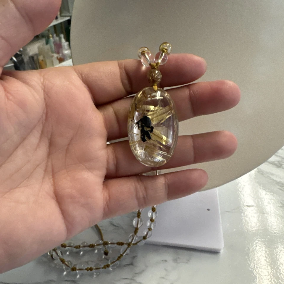 Colgante de cristal de titanio natural Foto 3 de 4