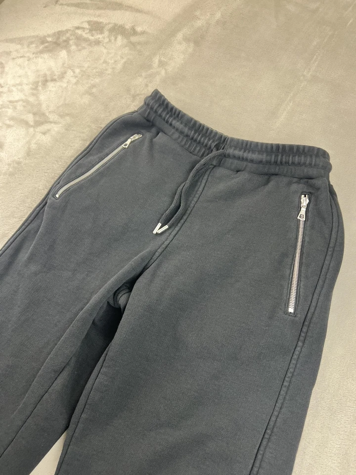 Pantalones deportivos Dries Van Noten para hombre pequeños negros Riri bolsillos con cremallera dobladillo crudo Foto 3 de 4