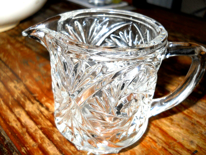 Small Clear cut glass creamer, 3" high, very pretty -catches light nicely, heavy