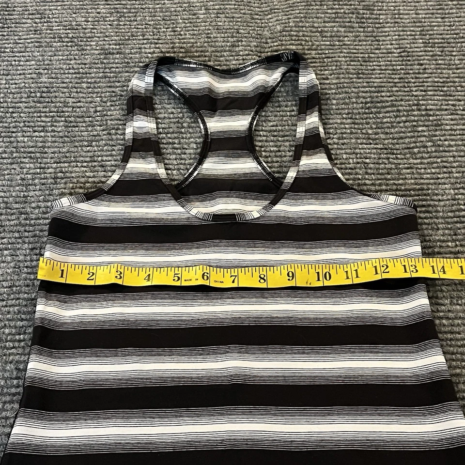 Camisa sin mangas Lululemon para mujer talla 8 espalda deportiva negra blanca a rayas ropa deportiva Foto 4 de 4