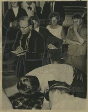 1966 Press Photo Last rites administered to Joel Mason by Reverend Romagosa.