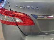 Used Left Tail Light Assembly fits: 2014 Nissan Sentra lid mounted Left Grade A