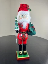 Large Christmas Nutcracker Santa Holding Christmas Tree and Bag of Presents