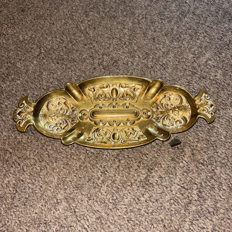An ornate antique brass desk tray described as rare — the kind of heavy, decorative piece that anchors a whole desk aesthetic and looks like it came out of a Gilded Age law office.