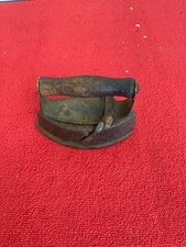 very old cast iron iron with wood handle