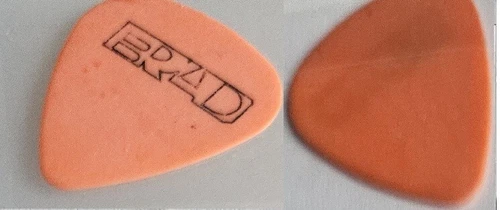 Image: https://i.ebayimg.com/images/g/r8AAAOSwBGFoTW3h/s-l500.webp Pearl Jam pick Stone Gossard Pick Orange Brad pick - Picture 1 of 1