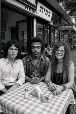 Jim Morrison/ Jimi Hendrix and Janis Joplin sitting at a Cafe Table