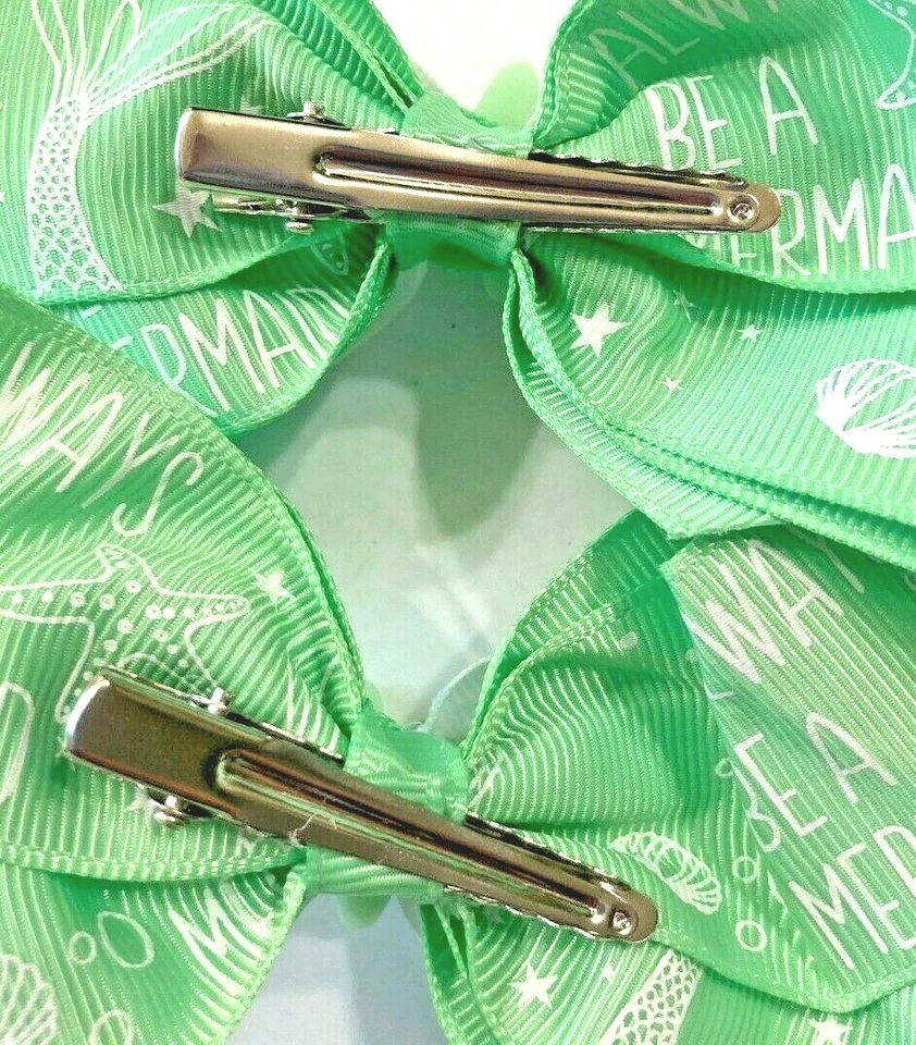 Hermoso conjunto de lazos de pelo de cola de cerdo inspirados en estrellas de mar verdes para niñas. Foto 3 de 3