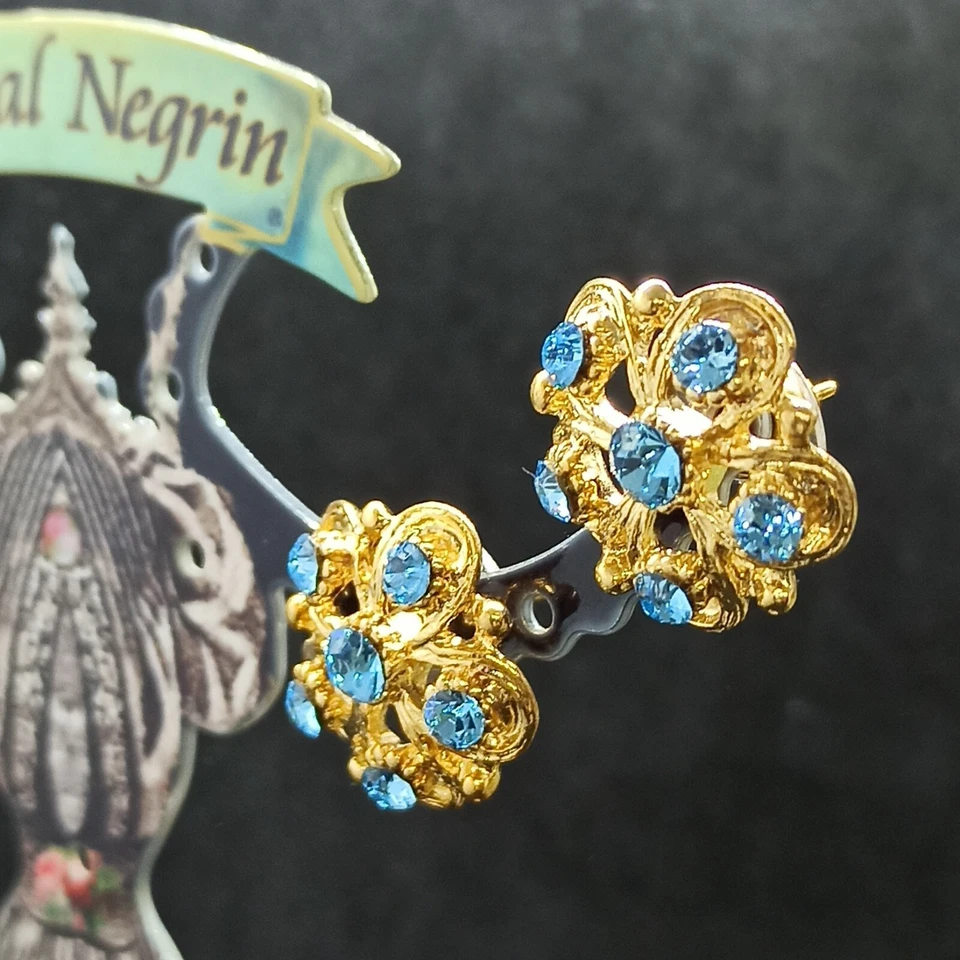 Pendientes con flores Michal Negrin poste grande chapados en oro y cristales de Swarovski azules Foto 4 de 4