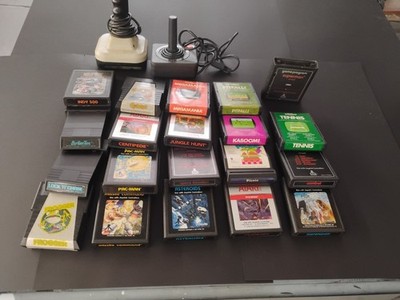 Atari Video Games Lot of 20 Plus 2 Controller Joysticks Untested