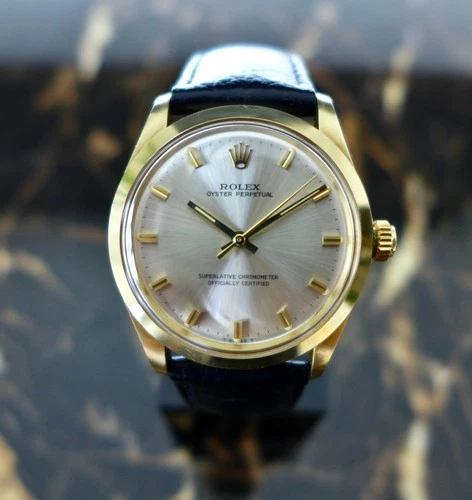 A STUNNING VINTAGE GENTS 1971 ROLEX OYSTER PERPETUAL IN 14K GOLD REF. 1002 34mm