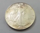 Toned - 1987 American Silver Eagle 1 Troy Oz .999 Fine Silver