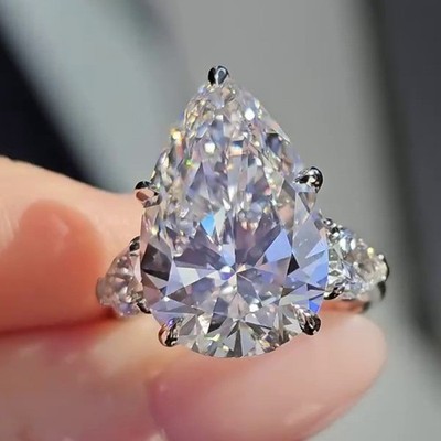 4.20 CTW Pear Cut Moissanite Three Stone Engagement Ring 14K White Gold Plated