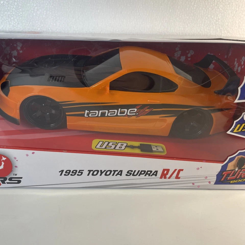 Jada Toys JDM Tuners 1995 Toyota Supra R/C coche escala 1:16 naranja negro NUEVO Foto 2 de 4