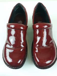 red patent leather clogs