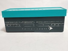 Bell and Howell slide tray hold 40 slides. Marketed as Micro-Mount and/or Master