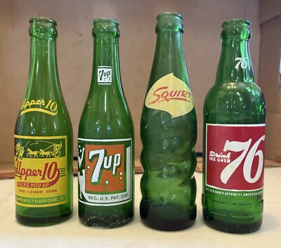 Four Soda Bottles.  Upper-10, 7-UP, Squirt, 76.