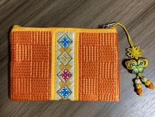 traditional Korean embroidered Bokjumeoni with a butterfly-shaped Norigae tassel