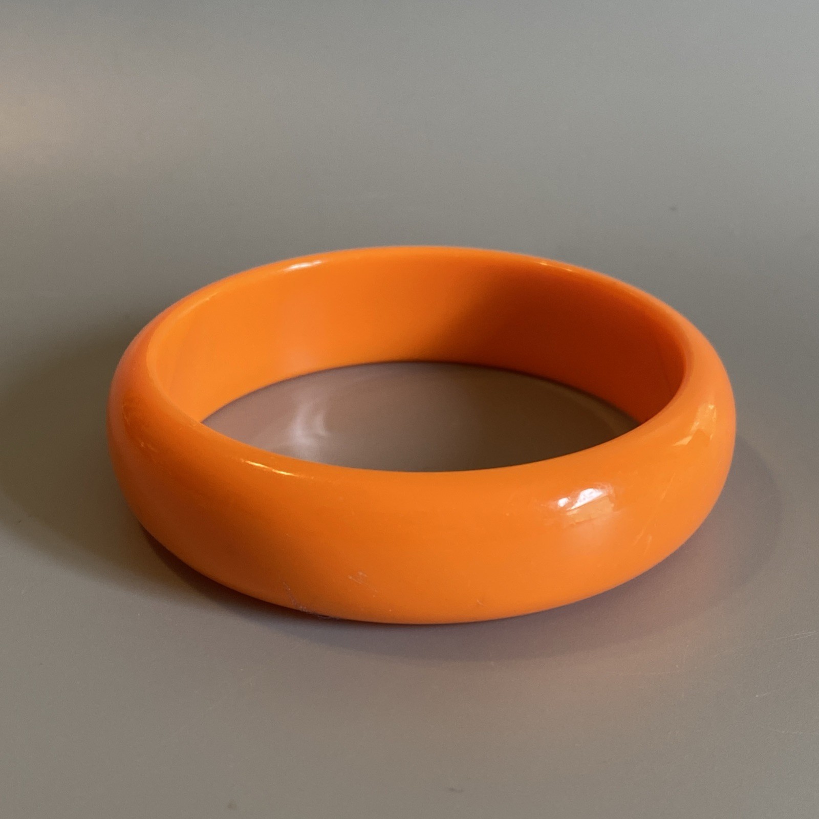 Vintage Solid Orange Bright Plastic Bangle Bracel… - image 1