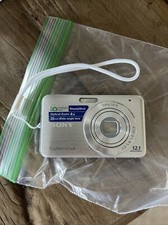 Silver sony ciber shot 12.1 sd card Included; Required Battery - Not Included