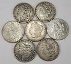 Lot of 7 Morgan Silver Dollars 90% Silver Coins $7 Face Value Mixed Dates
