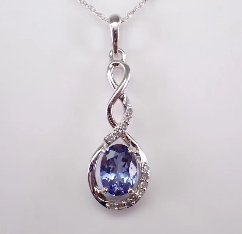 Oval Cut Simulated Blue Tanzanite Twisted Charm Pendant In 14K White Gold Plated