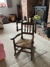 Antique child's rocking chair, woven seat, 65cm high (back), 26cm high (seat)