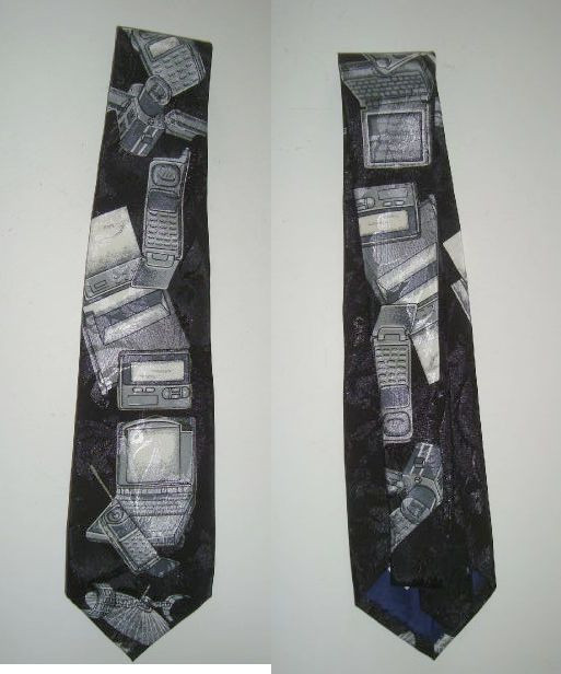 A vintage silk tie printed with actual electronic gadget schematics/designs by A. Rogers — a wearable piece of geek art history and a certified ice breaker.