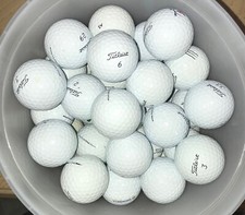 24 Titleist Pro V1 Golf Balls. 4A. Slight imperfections. Very playable balls.