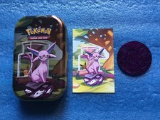 Pokémon Mimi Tin vuota di Espeon + moneta Purple Eevee e carta illustrata. Ita.