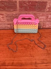 Rainbow-colored pop fidget purse