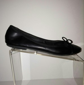 black flats with gold trim