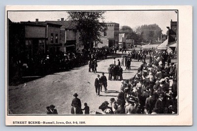 J90/ Russell Iowa Postcard c1910 Street Scene Parade Crowd Stores 593