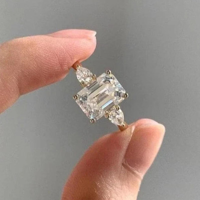 4.20 CTW Emerald Cut Moissanite Three Stone Wedding Ring 14K Yellow Gold Plated