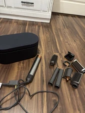 Dyson Airwrap Multi-Styler in nickel and copper with attachments