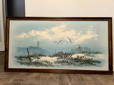 Beach view painting with a lighthouse fences and seagulls framed 26.5x51 in