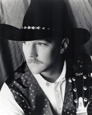 Trace Adkins 1990's portrait in black western hat with guitar 24x36 inch poster