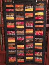 Quilted Wall Hanging/ 32x20.Machine Pieced Quilted Orange Mustard Black Brown