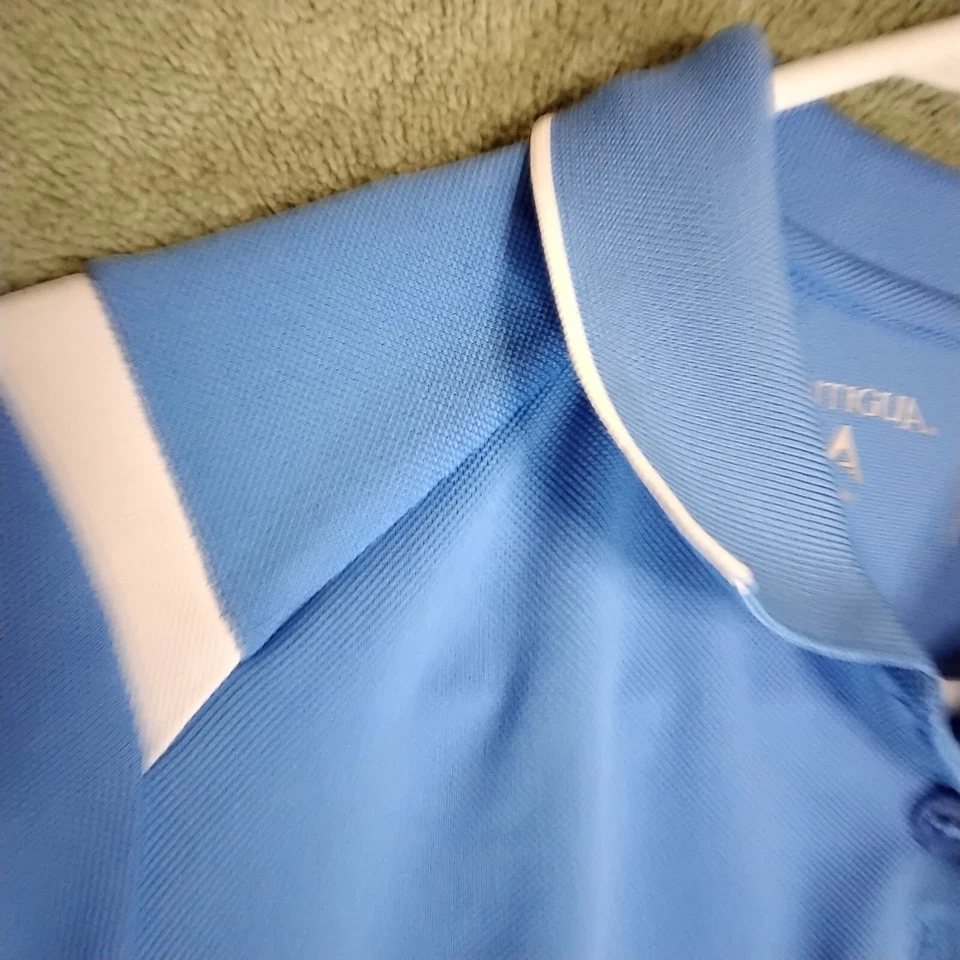 Camiseta polo Antigua para mujer talla M azul cielo blanco rayas manga corta botón Foto 4 de 4