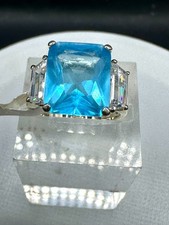 Emerald cut ring blue aquamarine sterling silver three stone cubic zirconia