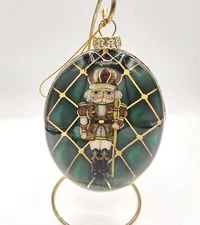 Blown Glass Oval Christmas Tree Ornament Nutcracker Inside Gold Glitter Half