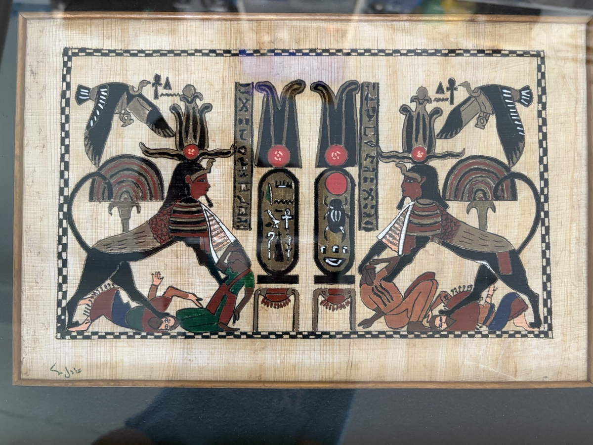 Framed signed papyrus(?) art featuring Spinx guarding the tomb of