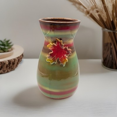 Stunning/9 /ceramic vase with a maple leaf design and a metallic glaze.