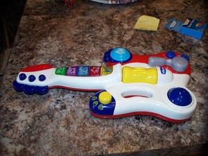 white toy guitar