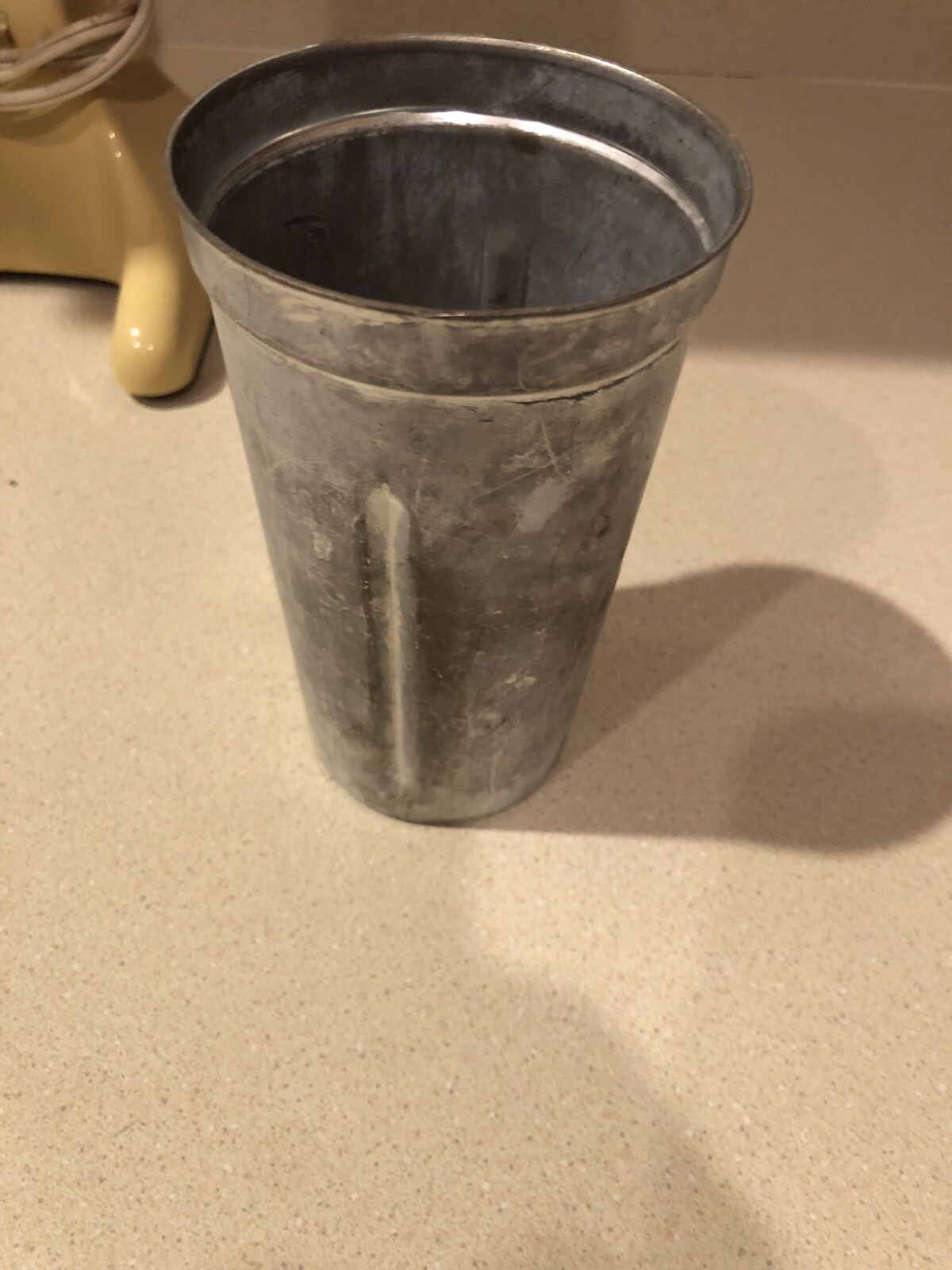 Beige Hamilton Beach Drink Master 727 milkshake maker with worn silver finish and subtle rust spots on a light countertop.